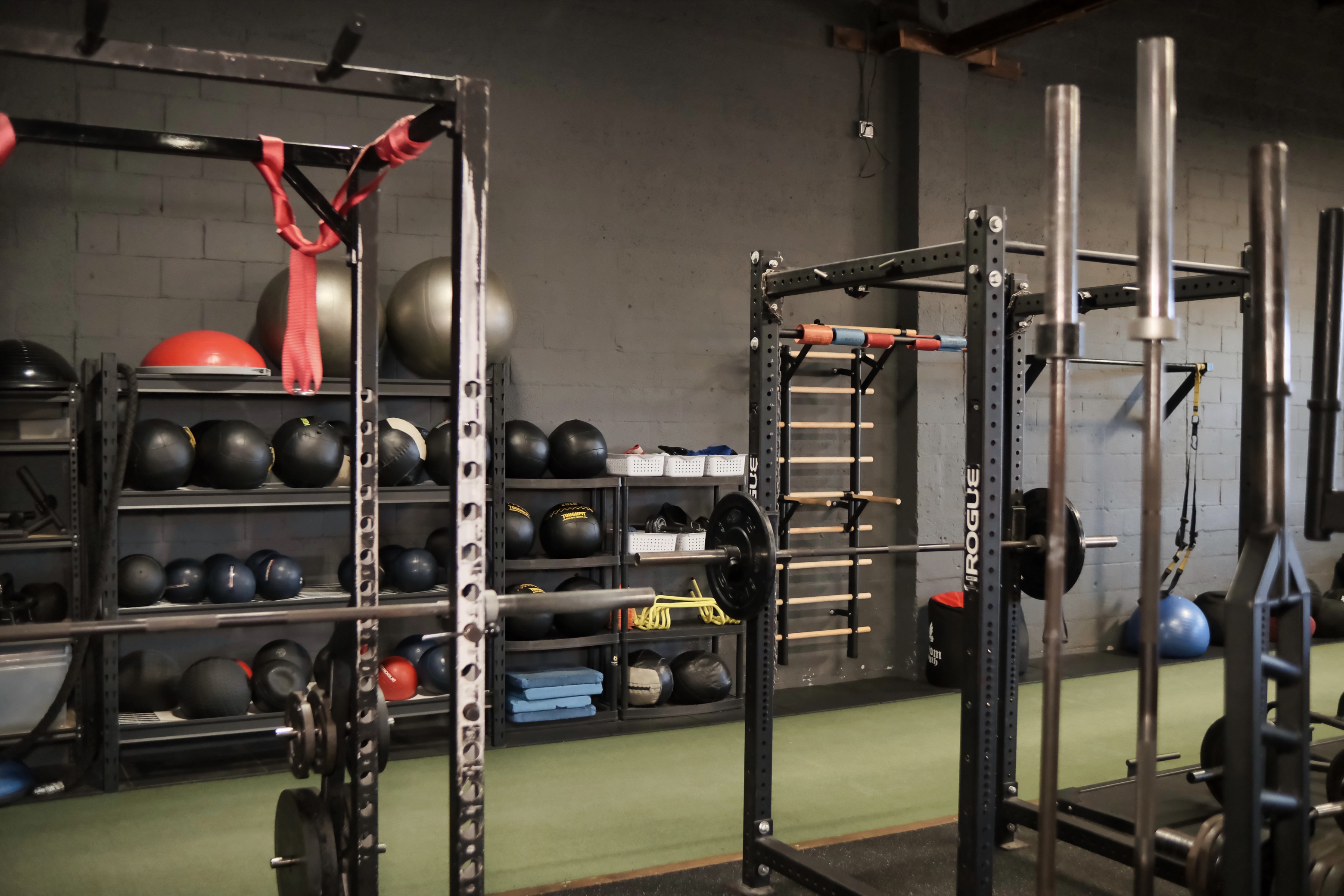 Gym equipment storage with organized shelving
